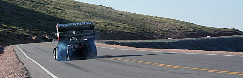 An avid artist, Paul Dallenbach uses his right foot and a 1,400-horsepower Banks Power twin-turbo Chevy V8 to paint thick black Continental rubber stripes on the asphalt while practicing on the upper section of the course.