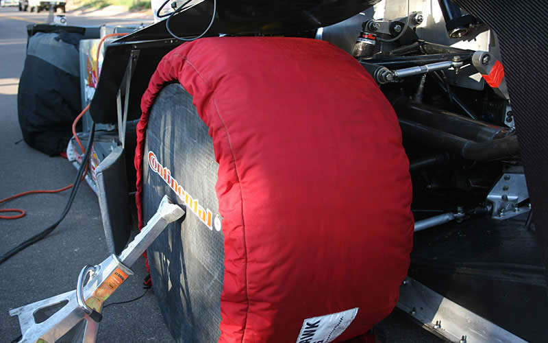 Cold temperatures and race tires do not go well together so the team employs tire warmers and side covers (along with a jack stand to keep the covers on in the gusty wind) to keep the tires at a balmy 180-degree surface temperature before runs.